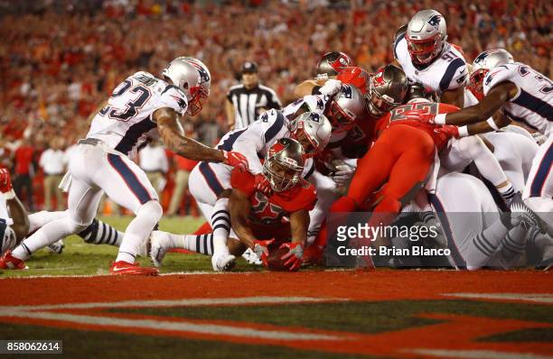 Running back Doug Martin of the Tampa Bay Buccaneers gets into the end zone on a one-yard rush for a touchdown during the second quarter of an NFL...