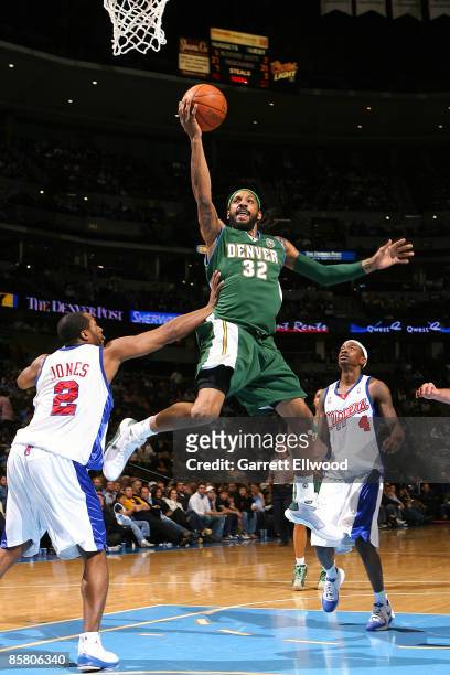 Renaldo Balkman of the Denver Nuggets goes to the basket against Fred Jones of the Los Angeles Clippers on April 4, 2009 at the Pepsi Center in...