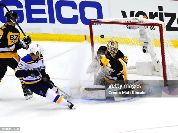 Matt Murray of the Pittsburgh Penguins has the game winning goal in overtime go past him as Jaden Schwartz of the St. Louis Blues looks on at PPG...