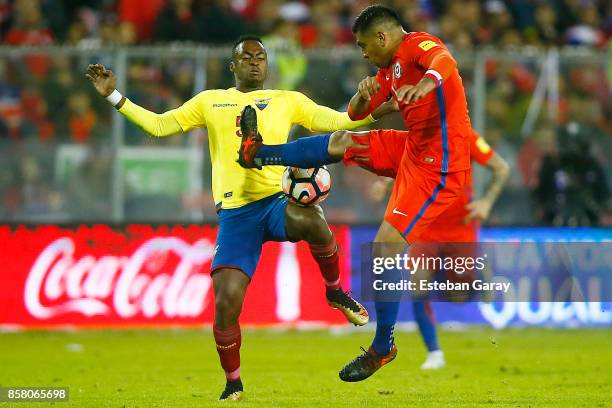 Gonzalo Jara of Chile fights for the ball with Renato Ibarra of Ecuador during a match between Chile and Ecuador as part of FIFA 2018 World Cup...