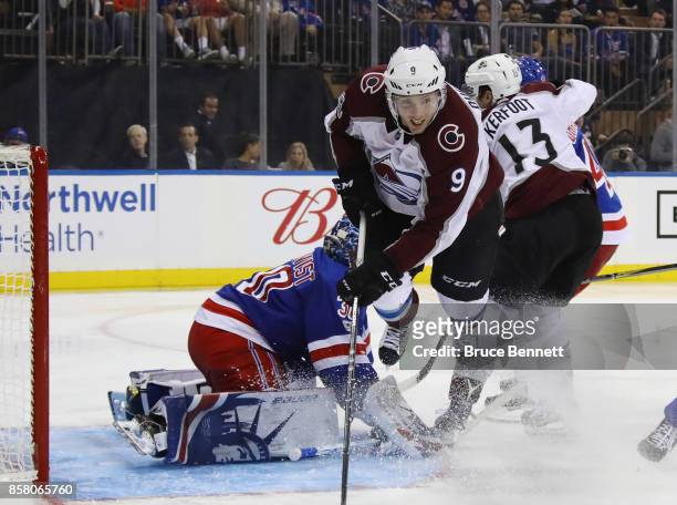 Matt Duchene of the Colorado Avalanche is tripped up as he misses a third period attempt against Henrik Lundqvist of the New York Rangers at Madison...