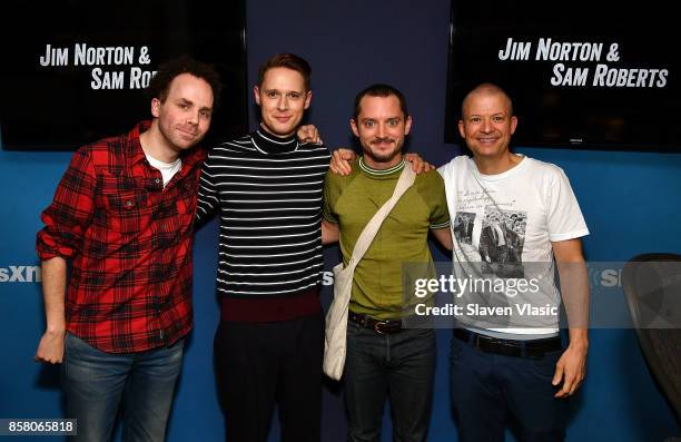 Sam Roberts, Samuel Barnett, Elijah Wood and Jim Norton pose for a photo at " Jim & Sam" at SiriusXM Studios on October 5, 2017 in New York City.