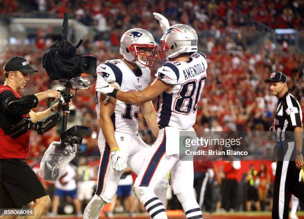 Wide receiver Chris Hogan of the New England Patriots celebrates with wide receiver Danny Amendola hauling in a 5-yard touchdown pass from...