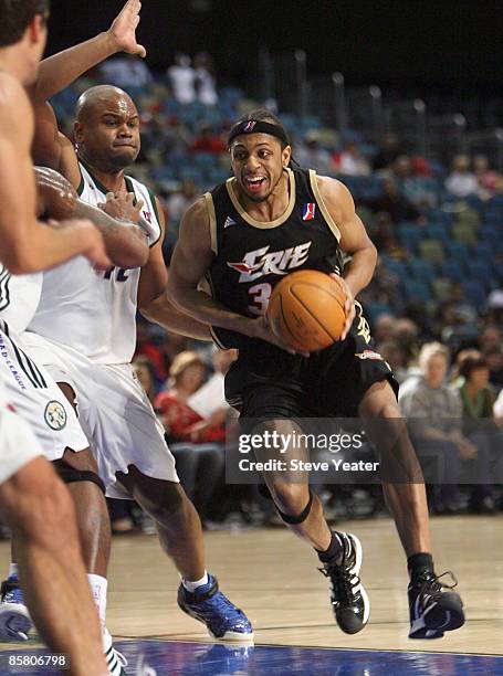 Ivan Harris of the Erie Bayhawks drives around Alton Ford of the Reno Bighorns during a D-League game at the Reno Events Center on April 4, 2009 in...