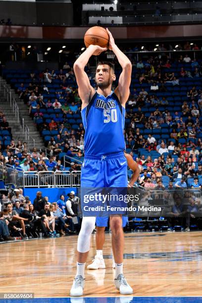 Salah Mejri of the Dallas Mavericks shoots a free throw against the Orlando Magic during a preseason game on October 5, 2017 at Amway Center in...