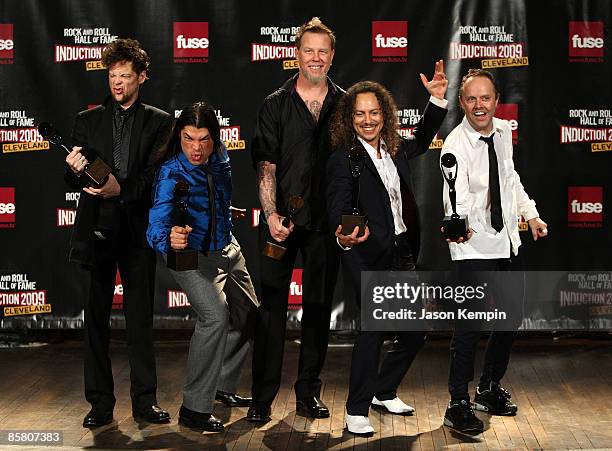 Jason Newsted, Robert Trujillo, James Hetfield, Kirk Hammett and Lars Ulrich of Metallica pose in the press room during the 24th Annual Rock and Roll...