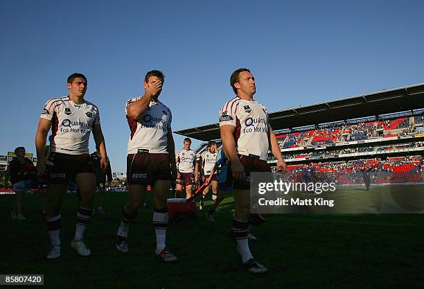 Shane Neumann, Josh Perry and Matt Orford of the Sea Eagles walk from the field after losing the round four NRL match between the Newcastle Knights...