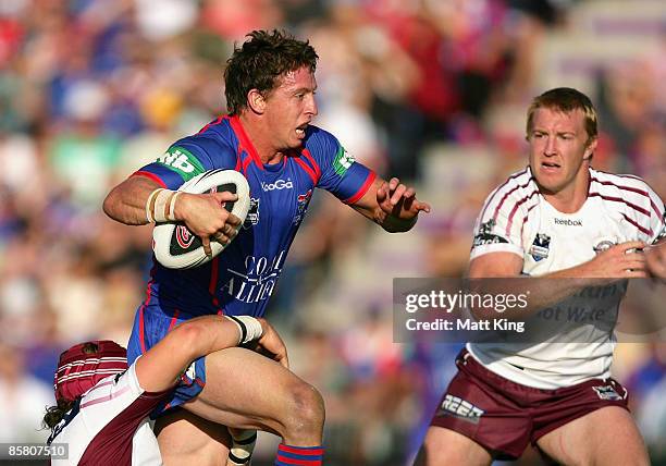 Kurt Gidley of the Knights takes on the defence during the round four NRL match between the Newcastle Knights and the Manly Warringah Sea Eagles at...