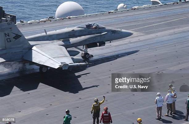 Vice President Dick Cheney observes an F/A-18 Hornet launch from the flight deck of the USS John C. Stennis March 15, 2002 while at sea. Cheney is in...