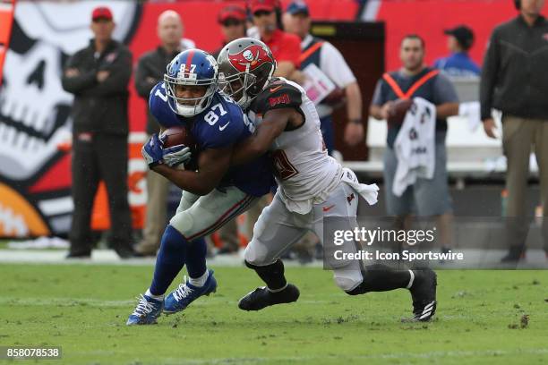 New York Giants wide receiver Sterling Shepard is tackled by Tampa Bay Buccaneers defensive back Robert McClain during the NFL game between the New...