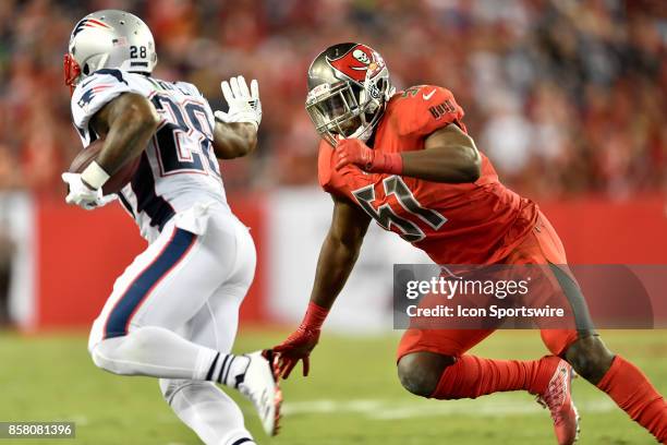 Tampa Bay Buccaneers linebacker Kendell Beckwith pursues New England Patriots running back James White during an NFL football game between the New...
