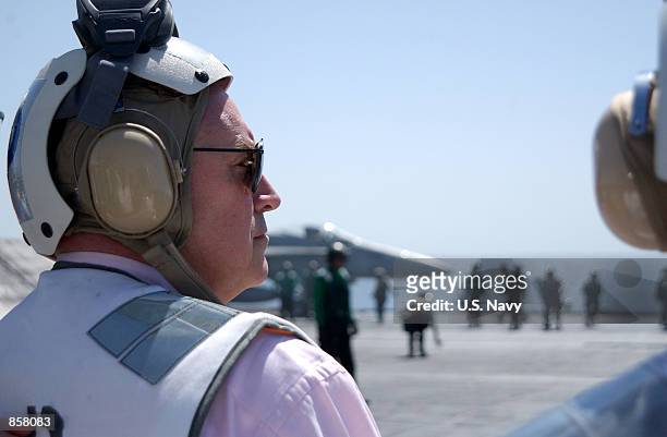 Vice President Dick Cheney observes aircraft launch operations on the flight deck of the USS John C. Stennis March 15, 2002 while at sea. Cheney is...