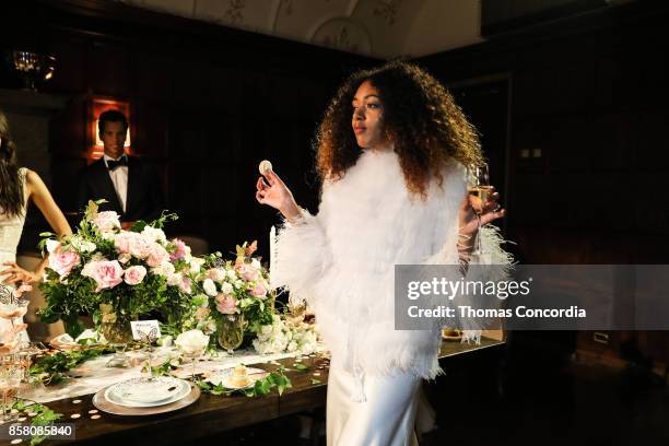 Model poses during the Monique Lhuillier Spring 2018 Bridal Presentation at the Academy Mansion on October 5, 2017 in New York City.