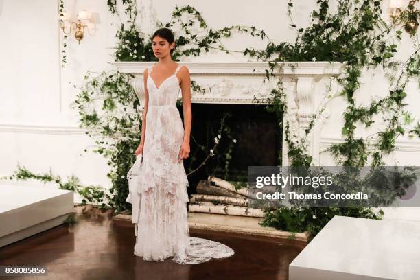 Model poses during the Monique Lhuillier Spring 2018 Bridal Presentation at the Academy Mansion on October 5, 2017 in New York City.