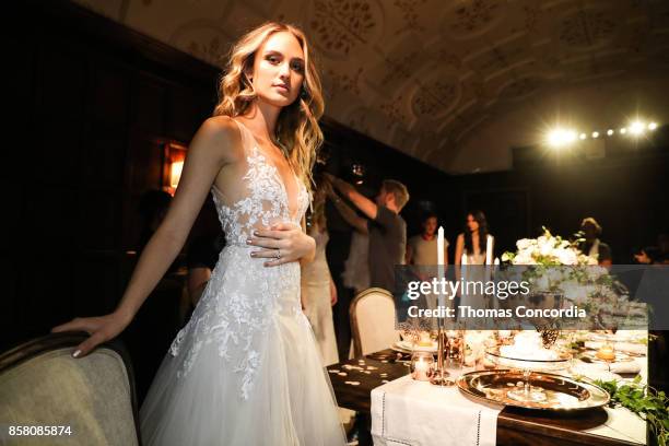 Model poses during the Monique Lhuillier Spring 2018 Bridal Presentation at the Academy Mansion on October 5, 2017 in New York City.