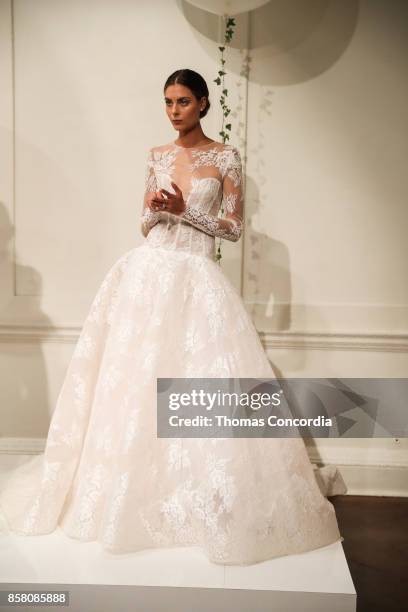 Model poses during the Monique Lhuillier Spring 2018 Bridal Presentation at the Academy Mansion on October 5, 2017 in New York City.