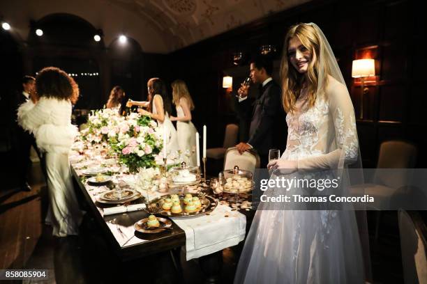 Model poses during the Monique Lhuillier Spring 2018 Bridal Presentation at the Academy Mansion on October 5, 2017 in New York City.