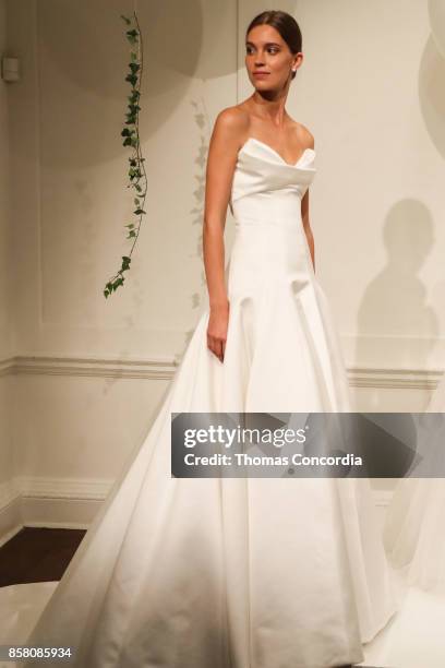 Model poses during the Monique Lhuillier Spring 2018 Bridal Presentation at the Academy Mansion on October 5, 2017 in New York City.