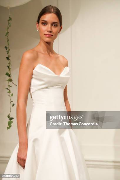 Model poses during the Monique Lhuillier Spring 2018 Bridal Presentation at the Academy Mansion on October 5, 2017 in New York City.