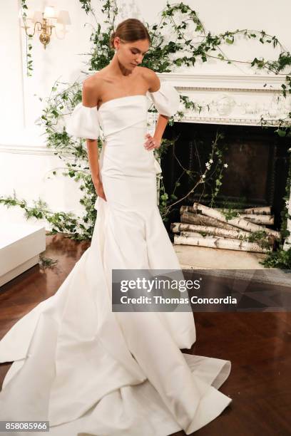 Model poses during the Monique Lhuillier Spring 2018 Bridal Presentation at the Academy Mansion on October 5, 2017 in New York City.