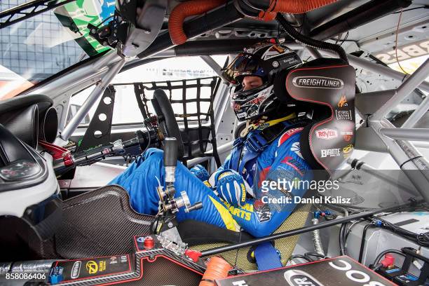Andre Heimgartner driver of the Freightliner Racing Holden Commodore VF looks on during practice ahead of this weekend's Bathurst 1000, which is part...