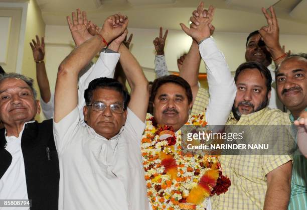 Indian Congress party election candidate and sitting Member of Legislative Assembly O.P Soni gestures with former Congress MLA Jasbir Singh Dimpa and...