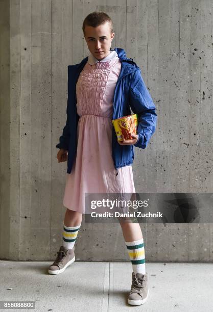 Comic Con cosplayer dressed as Eleven from "Stranger Things" poses during 2017 New York Comic Con - Day 1 on October 5, 2017 in New York City.