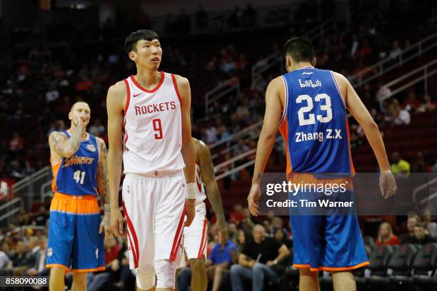 Zhou Qi of Houston Rockets reacts to a foul in the second half against the Shanghai Sharks at Toyota Center on October 5, 2017 in Houston, Texas....