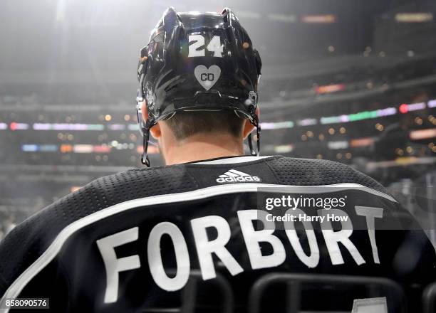 Derek Forbort of the Los Angeles Kings wears a helmet with initials CD in honor of King's employee Christiana Duarte who was killed in the Las Vegas...