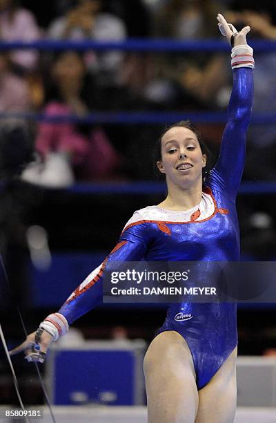 Britain's Elizabeth Tweddle ends her performance on uneven bars to win gold in the Apparatus final of the Third European Women's Artistic...