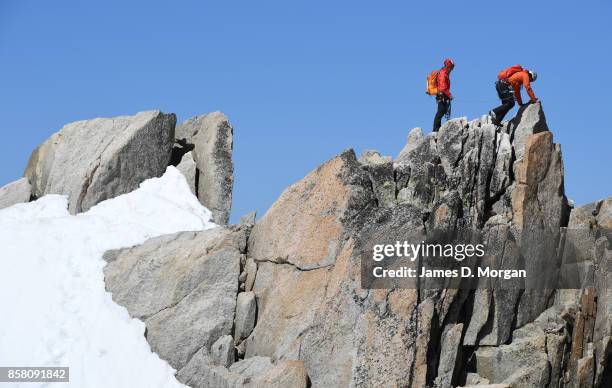 Hikers seen climbing to the top of rocky outcrop in France at June 16th 2017.
