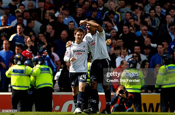 Swansea player Darren Pratley celebrates with goalscorer Joe Allen during the Coca Cola Championship match between Cardiff City and Swansea City at...