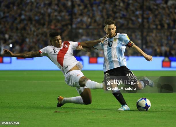 Lionel Messi of Argentina in action against Wilder Cartagena of Peru during the 2018 FIFA World Cup Qualification match between Argentina and Peru at...