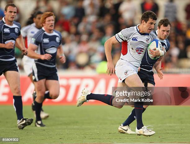 Zachary Test of the USA heads for the tryline during day three of the IRB Adelaide International Rugby Sevens Cup match between Scotland and USA at...