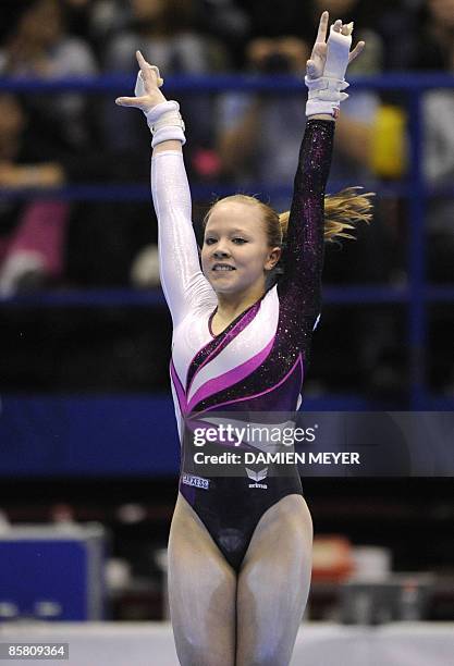 Germany's Anja Brinker finishes her performance on uneven bars to win bronze during the Apparatus final of the Third European Women's Artistic...