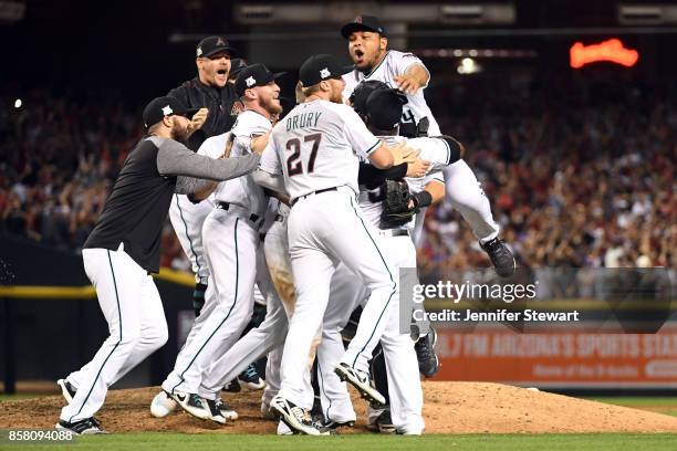 Members of the Arizona Diamondbacks celebrate after the Diamondbacks defeated the Colorado Rockies in the National League Wild Card game at Chase...