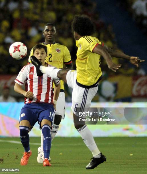 Carlos Sanchez, of Colombia, vies for the ball with Angel Romero, of Paraguay, during a match between Colombia and Paraguay as part of FIFA 2018...