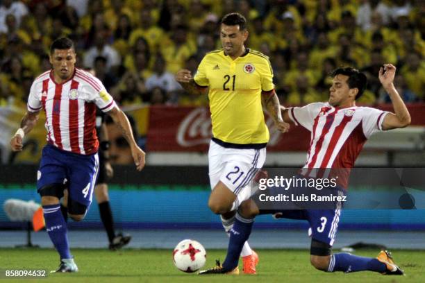 Edwin Cardona, of Colombia, vies for the ball with Gustavo Gomez, of Paraguay, during a match between Colombia and Paraguay as part of FIFA 2018...