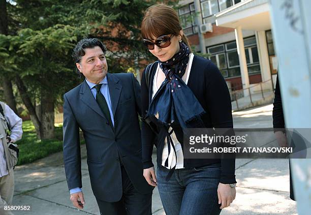 Ljubomir Frckovski, presidential candidate of the main opposition and centre-left Social Democratic Union of Macedonia party and his wife Irena leave...