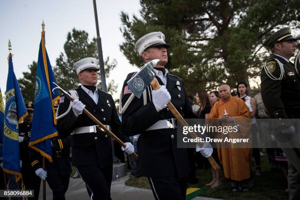 An honor guard arrives at the start of a vigil for Las Vegas Metropolitan Police Department Officer Charleston Hartfield at Police Memorial Park on...