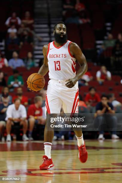 James Harden of Houston Rockets brings the ball down the court in the first half against the Shanghai Sharks at Toyota Center on October 5, 2017 in...