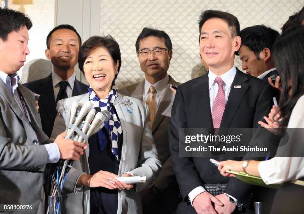 Tokyo Metropolitan Governor and Kibo no To head Yuriko Koike and the Democratic Party Preesident Seiji Maehara speak to media reporters after their...