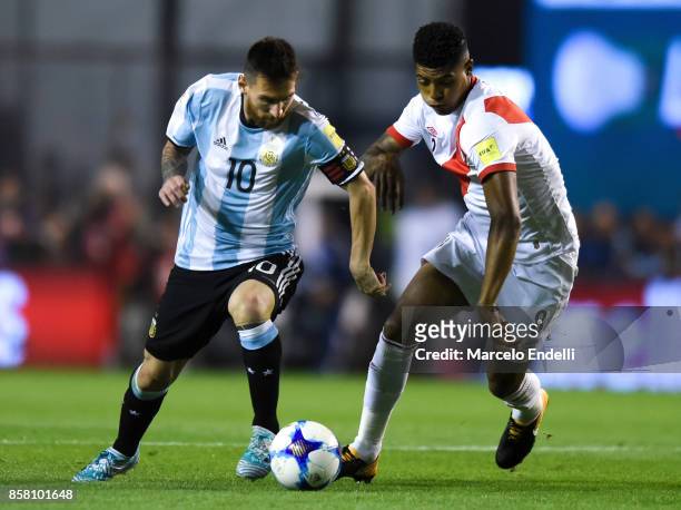 Lionel Messi of Argentina fights for ball with Wilder Cartagena of Peru during a match between Argentina and Peru as part of FIFA 2018 World Cup...