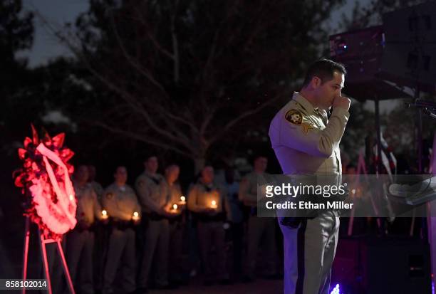 Las Vegas Metropolitan Police Department Sgt. Chris Dennis speaks during a vigil for Las Vegas Metropolitan Police Department Officer Charleston...