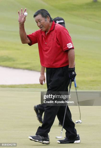 Masashi "Jumbo" Ozaki acknowledges the gallery after shooting his age in the second round of the Honma Tourworld Cup, a regular Japanese professional...