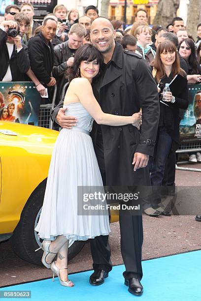 Carla Gugino and Dwayne Johnson attend the UK premiere of Race To Witch Mountain at Odeon West End on April 5, 2009 in London, England.