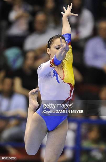 Romania's Adriana Tamirjan performs on beam to win silver during the Apparatus final of the Third European Women's Artistic Championships on April 5,...