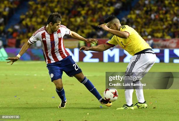 Frank Fabra, of Colombia, vies for the ball with Angel Romero, of Paraguay, during a match between Colombia and Paraguay as part of FIFA 2018 World...