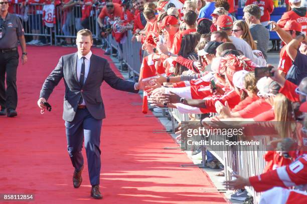 Jimmy Howard of the Detroit Red Wings gives high fives to the crowd during the red carpet walk in ceremonies prior to the Detroit Red Wings game...