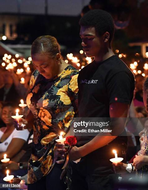 Veronica Hartfield , widow of slain Las Vegas Metropolitan Police Department Officer Charleston Hartfield, and their son Ayzayah Hartfield attend a...